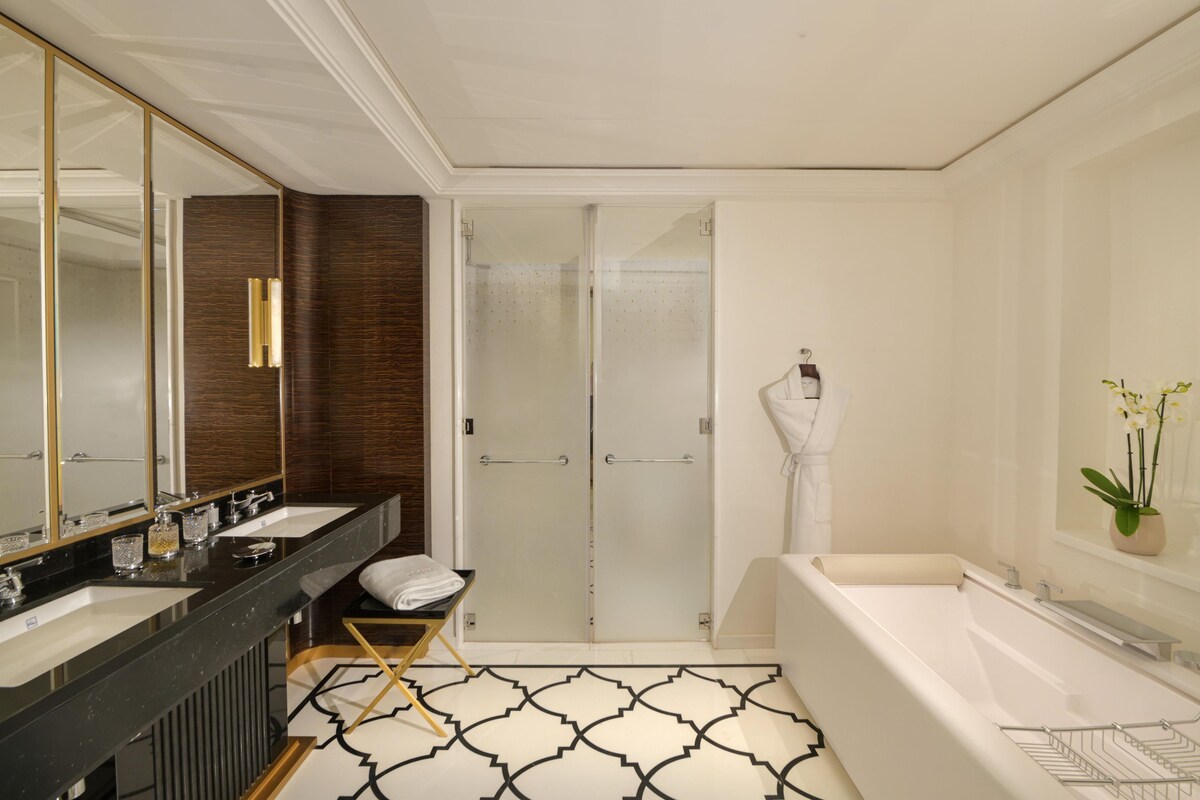 Bathroom | Deep soaking tub, rainfall showerhead, designer toiletries, hair dryer
