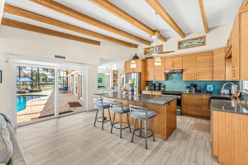Tropical Riverfront Retreat w/ Pool, Tiki Hut & Dock! 🌴