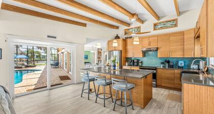 Tropical Riverfront Retreat w/ Pool, Tiki Hut & Dock! 🌴
