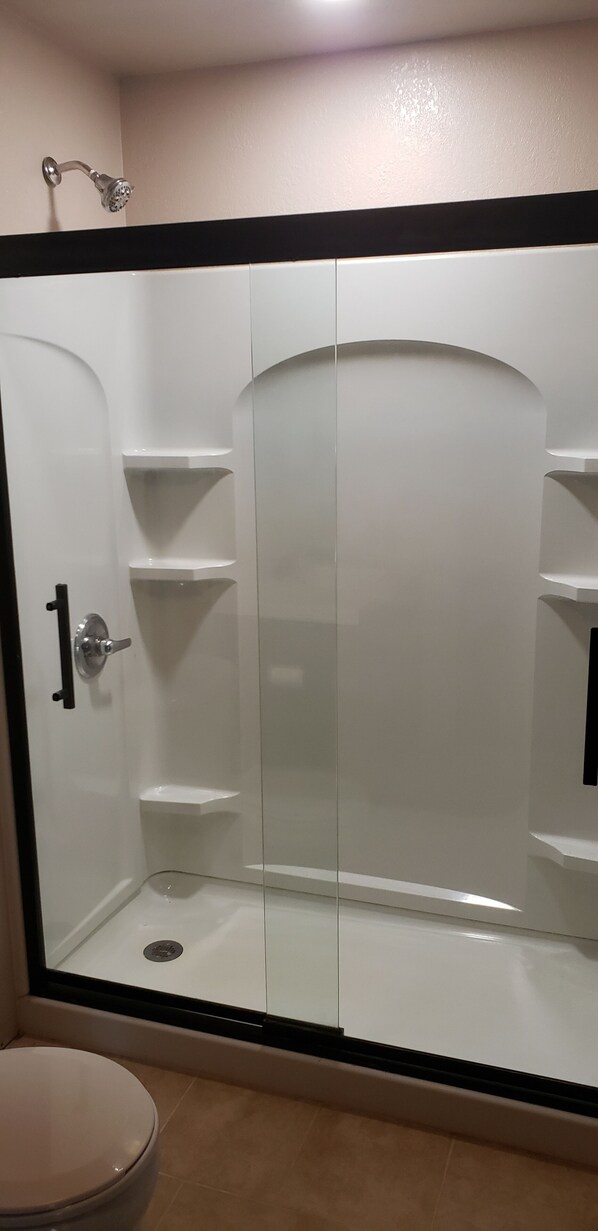 Shower, towels, soap, toilet paper