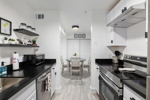 Standard Apartment, 1 Queen Bed with Sofa bed, Non Smoking, Patio | Private kitchen | Full-sized fridge, microwave, oven, stovetop - Cozy UF Condo Near Shands UF on Archer (Gainesville)