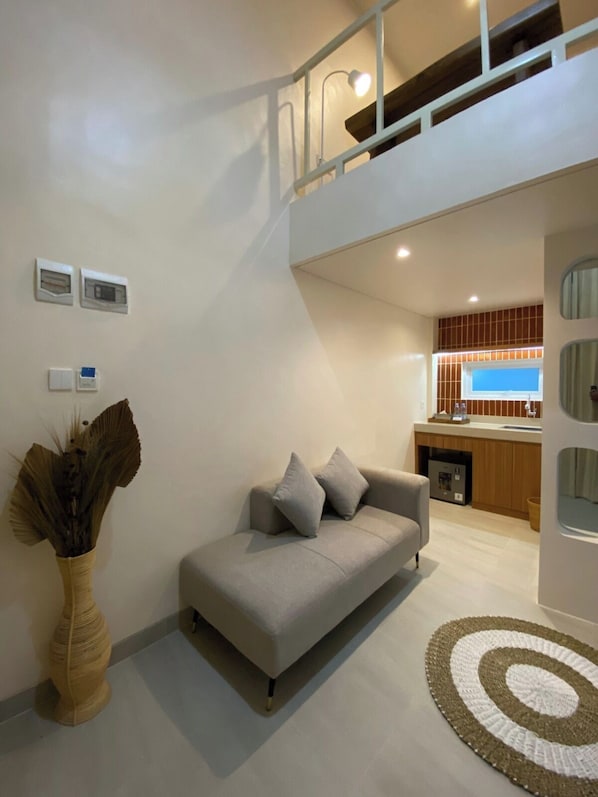 Quarto casal luxo | Área de estar