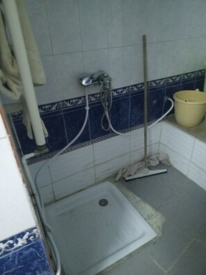 Shower, towels, soap, toilet paper