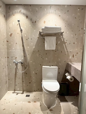Deluxe Double Room, City View | Bathroom | Shower, hair dryer, slippers, towels