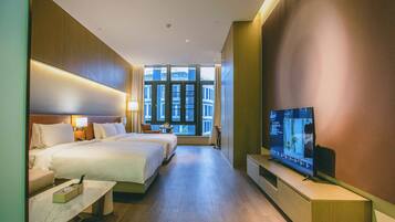 Chambre exécutive double ou avec lits jumeaux | Couette en duvet, articles de minibar gratuits, coffre-fort