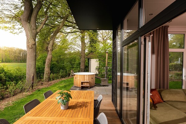 Outdoor dining - Everything you need in 1 wellness cottage. Beautiful place, lovely cottage, wellness and a baby room en suite. (Zuna)