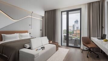 Deluxe King Room with Balcony | Premium bedding, memory-foam beds, minibar, in-room safe