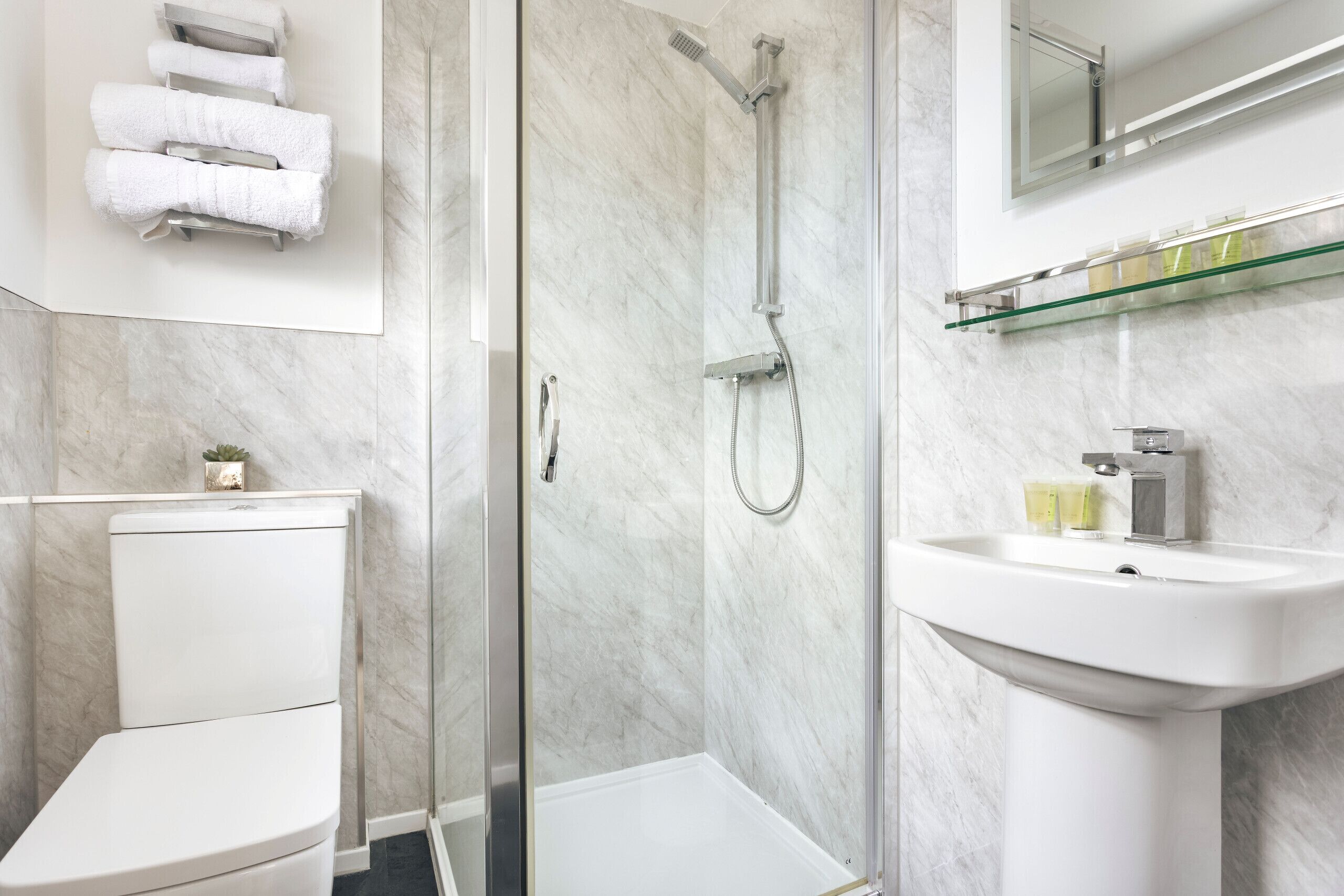 Shower, hair dryer, towels