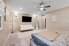 Large king suite with Smart TV, ceiling fan, and generous layout. Located on the main level for easy access and added convenience.