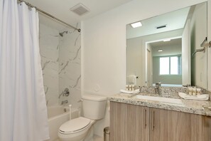 Shower, hair dryer, towels