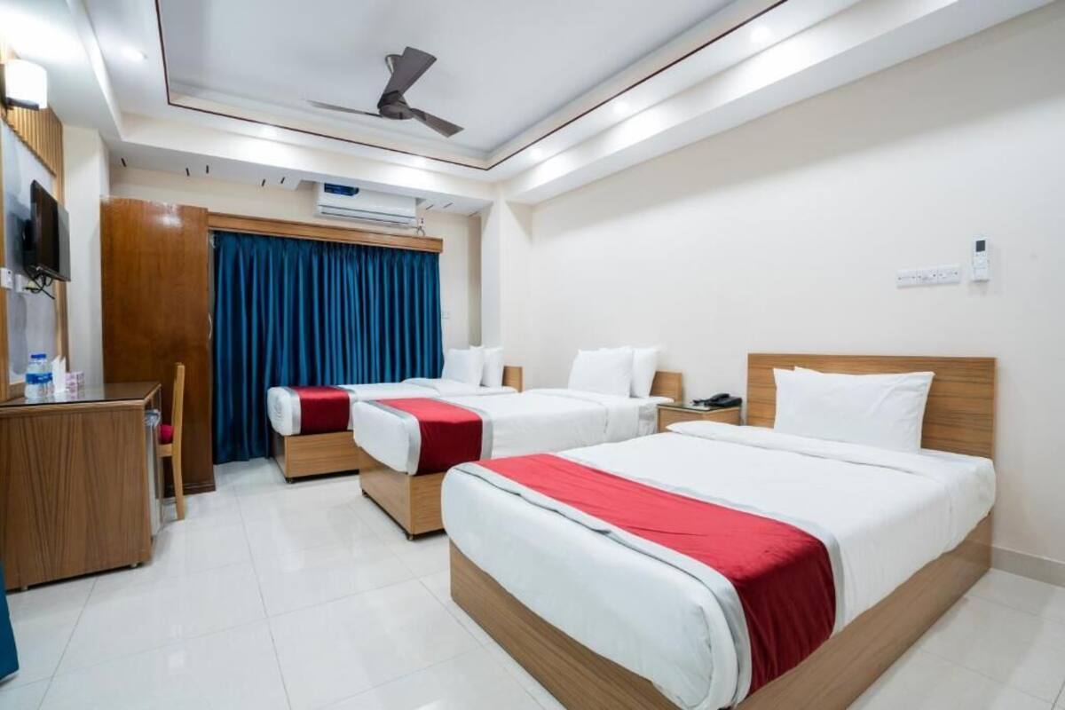 Deluxe Triple Room, City View | In-room safe, desk, laptop workspace, soundproofing