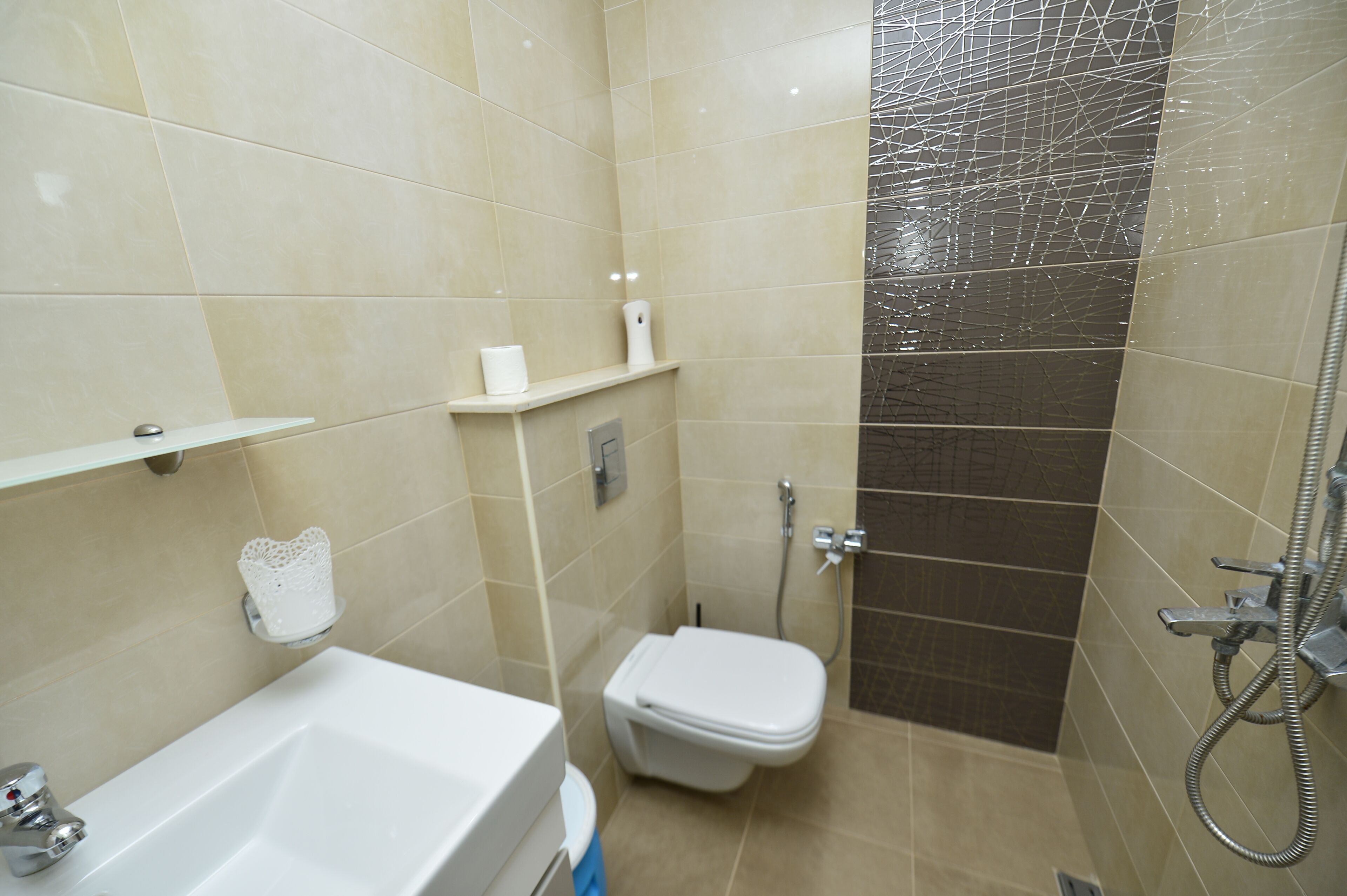 A bathroom with a bathtub, toilet, and shower.