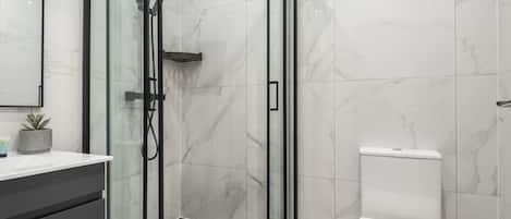 Shower, hair dryer, towels, shampoo