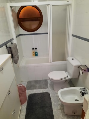 Bidet, towels, soap, toilet paper