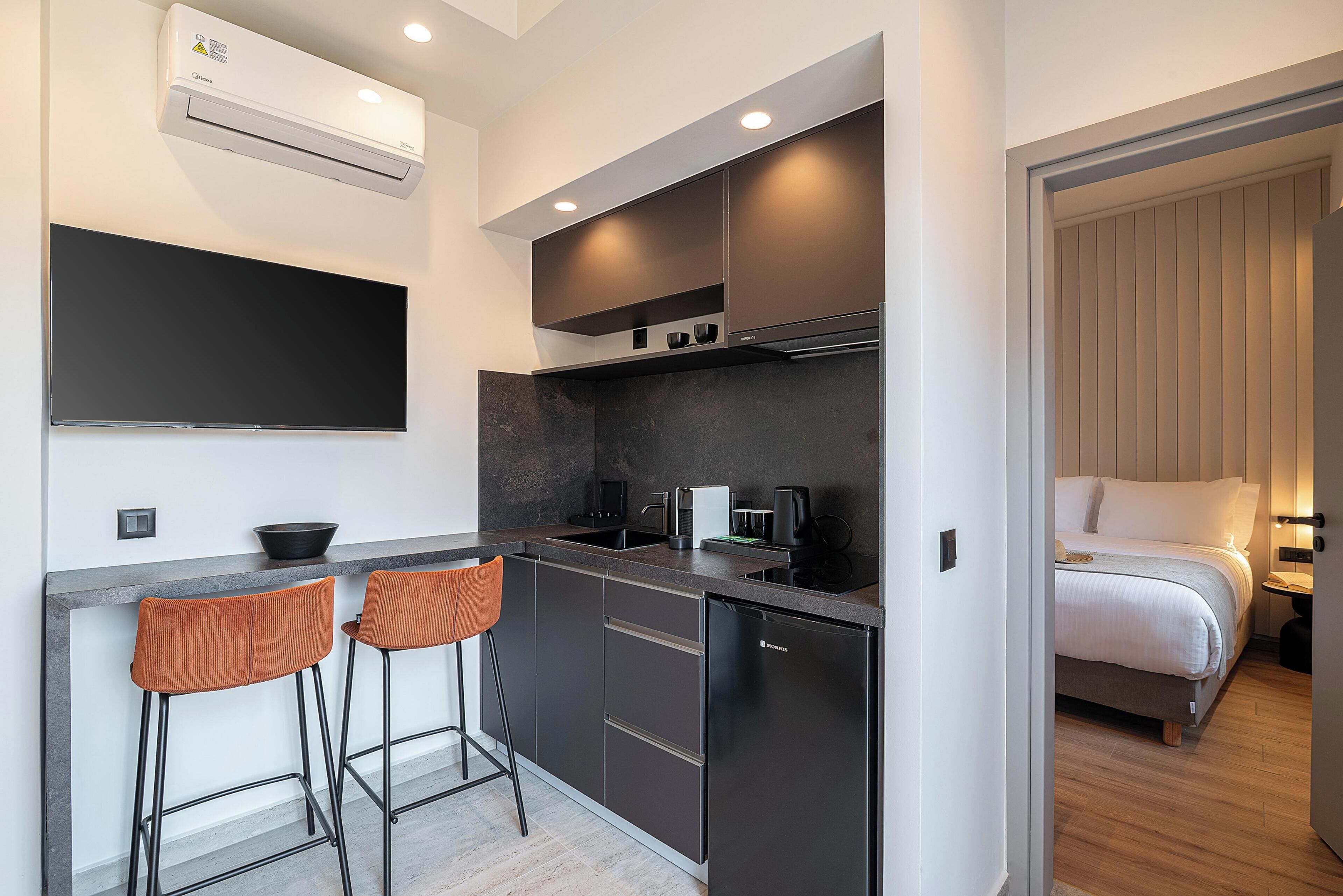 Suite familiar, vistes a la ciutat | Zona de menjador de l'habitació