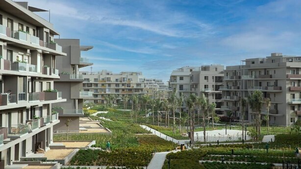 A modern residential complex with multi-story buildings, balconies, and landscaped gardens. - Kennah Studio | Villette Sodic, New Cairo (New Cairo)