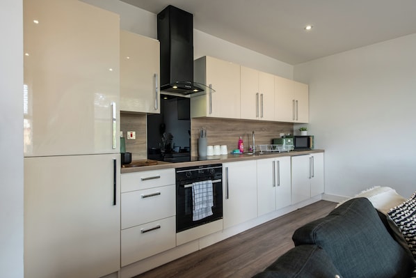 Apartment | Private kitchen | Full-size fridge, microwave, oven, stovetop