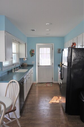 Fridge, microwave, oven, coffee/tea maker - Welcome to The Great Escape, a charming second-row beach house designed for comfort, convenience, and coastal charm. (Surf City)
