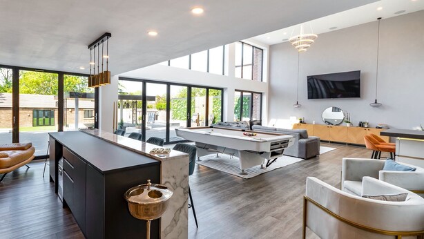 A modern kitchen with a central island, a dining area with a pool table, and a living space with a sofa and chairs. - 5 Bed Villa-sleeps 10-hot Tub-bar & Pool Table (Doncaster)