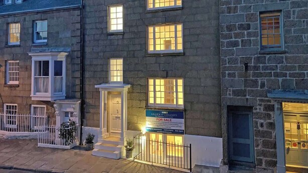 A stone building with a 'For Sale' sign, featuring a traditional design with multiple windows and a small porch. - Breathtaking views on historical street- central (Penzance)