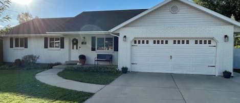 Front of the home with a two-car garage and wide driveway