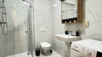 Shower, hair dryer, towels, soap