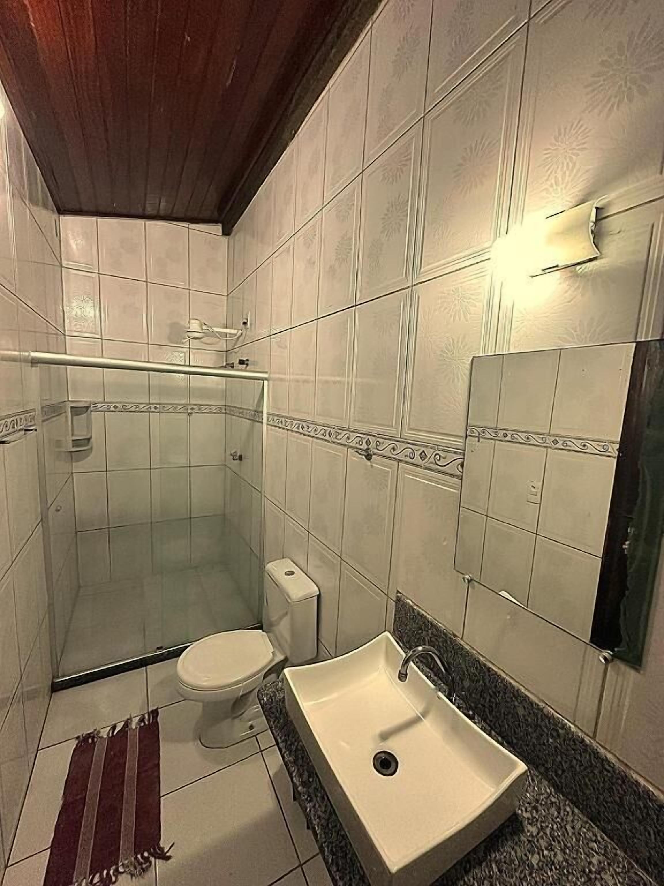 Shower, hair dryer, towels, toilet paper