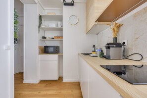 Fridge, microwave, stovetop, coffee/tea maker