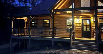 Escape to nature in this stunning new Log Home, nestled on 4 private acres,