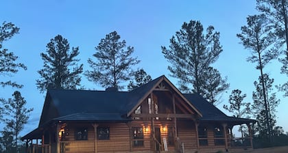 Escape to nature in this stunning new Log Home, nestled on 4 private acres,