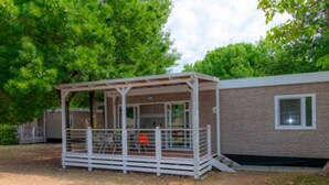 A small, single-story building with a covered outdoor seating area. - The Garda Village Caravan Park, Sirmione (Sirmione)