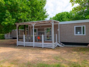 A small, single-story building with a covered outdoor seating area. - The Garda Village Caravan Park, Sirmione (Sirmione)