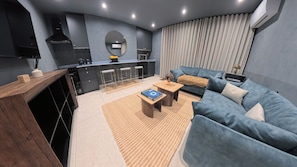 Grand Apartment, 1 Bedroom, Air conditioning, City View | Living area
