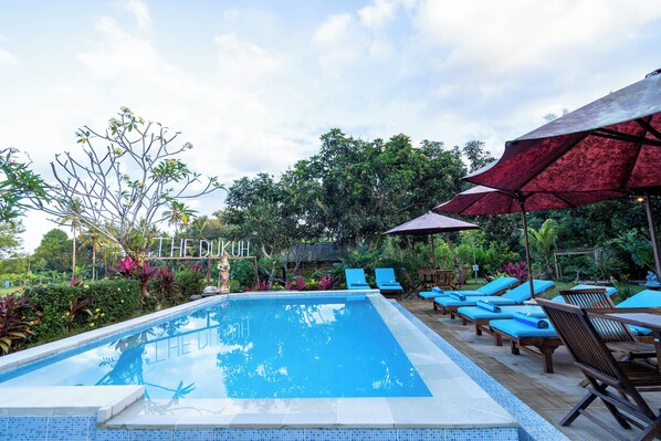 Outdoor pool, pool umbrellas, pool loungers