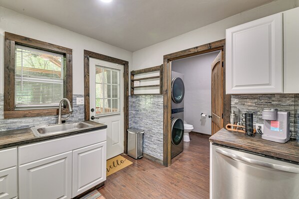 A compact kitchen with a sink, a coffee maker, and a dishwasher. - 3 Mi to Lake Texoma: Gordonville Getaway! (Gordonville)