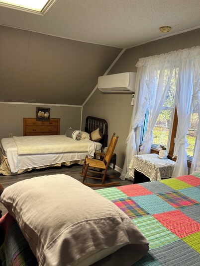 Charming 3-bedroom farmhouse with 2 full baths in a quiet country setting.