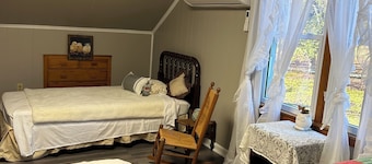 Charming 3-bedroom farmhouse with 2 full baths in a quiet country setting.