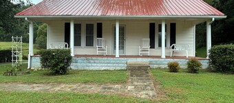 Charming 3-bedroom farmhouse with 2 full baths in a quiet country setting.