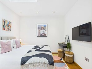 1 bedroom, desk, iron/ironing board, travel crib