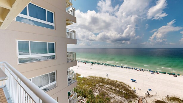 A beachfront hotel with multiple balconies overlooking the ocean. - Destin Towers 113 2 Bedroom Condo (Destin)
