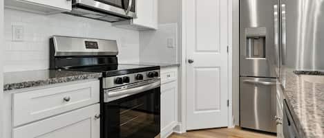 Townhome, 3 Bedrooms | Private kitchen | Fridge, oven, coffee/tea maker