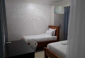 Deluxe Twin Room, Courtyard View | Desk, laptop workspace, soundproofing, iron/ironing board