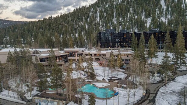 A resort with multiple buildings, a swimming pool, and a snowy landscape. - Resort at Squaw Creek Tahoe Hyatt 2Bd/2Ba Fireplace Suite (Olympic Valley)