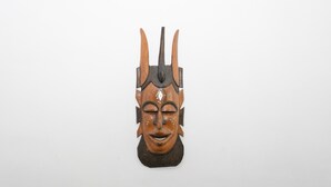 A wooden mask with horns and a central vertical element. - Spacious T2 with Unobstructed View (Lorient)