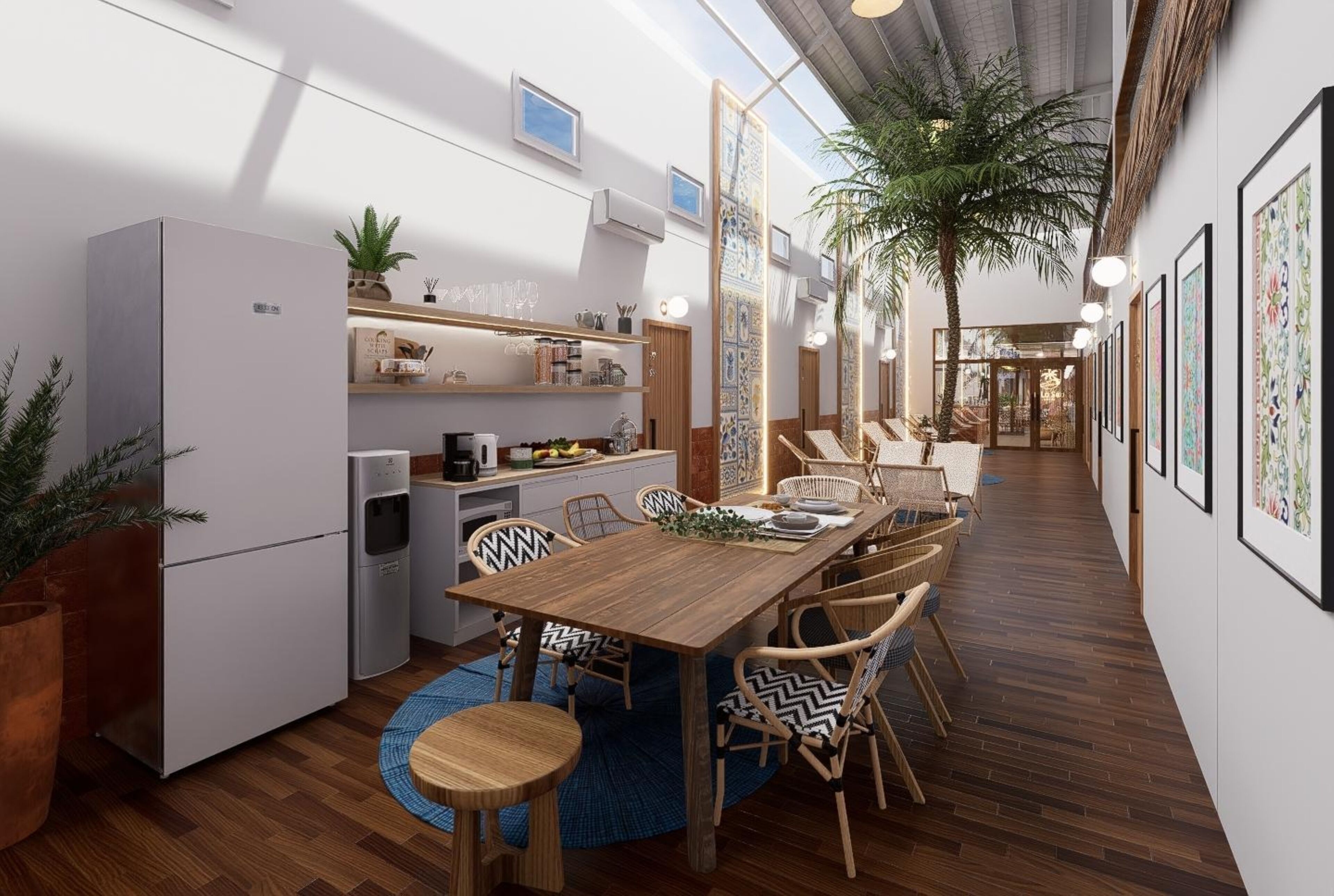 A compact kitchen with modern appliances, a dining area with wooden furniture, and a hallway with artwork.
