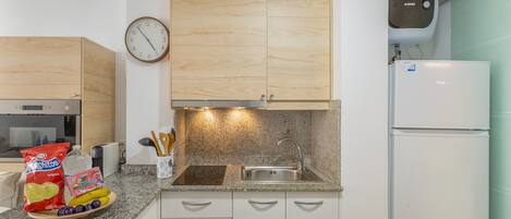 Fridge, microwave, stovetop, coffee/tea maker