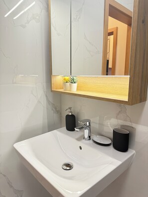 Shower, hair dryer, towels, soap