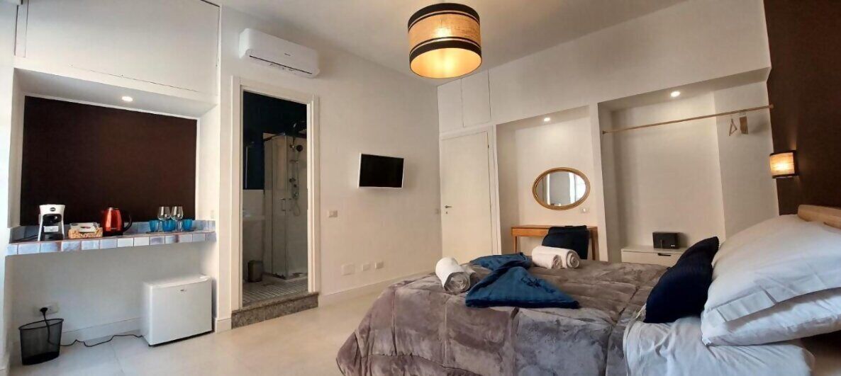 Deluxe Triple Room, City View | Hypo-allergenic bedding, memory foam beds, in-room safe, desk