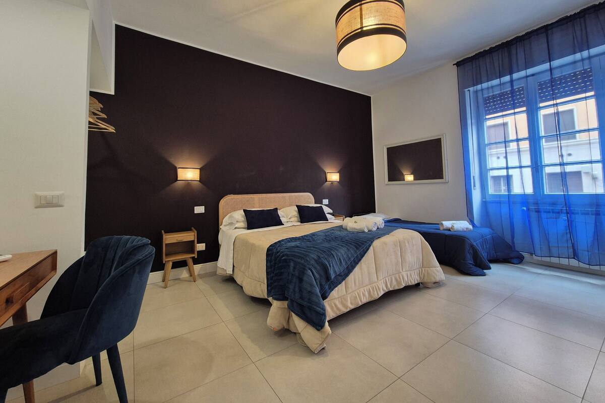 Deluxe Triple Room, City View | Hypo-allergenic bedding, memory foam beds, in-room safe, desk