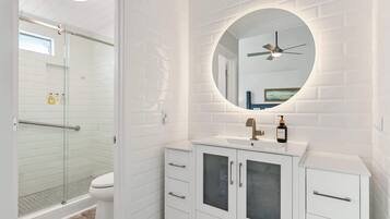 Shower, hair dryer, towels, shampoo